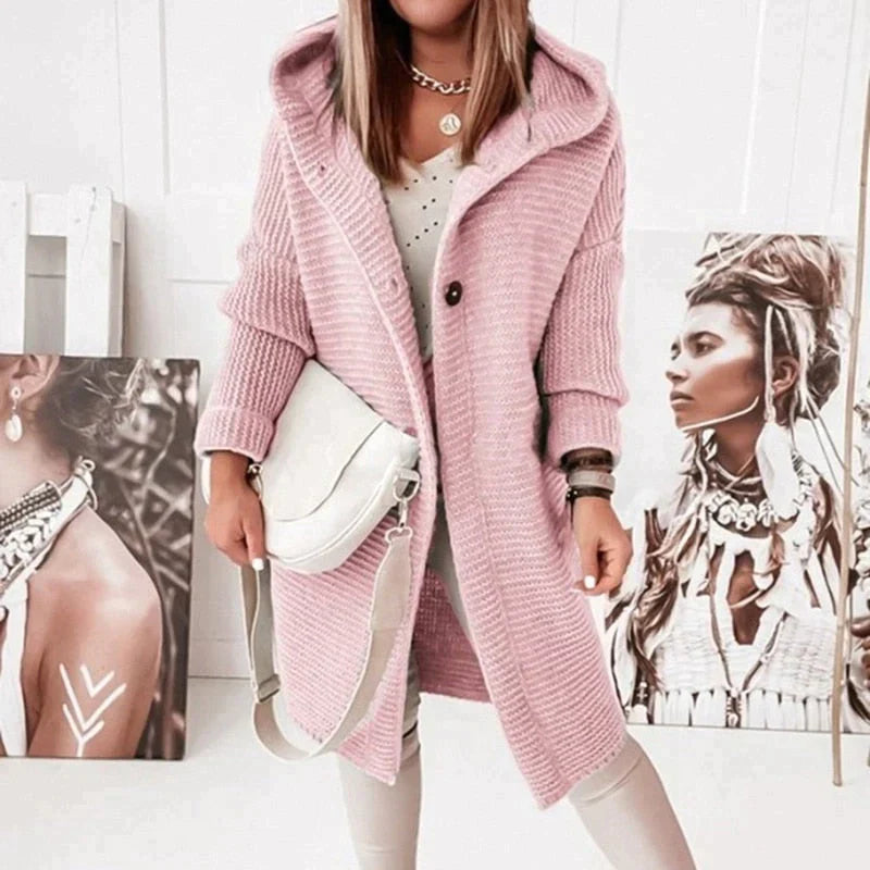 Pink long hooded cardigan with dark front buttons.
