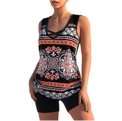 Black tankini with coral and white ornamental print and plain black shorts.