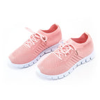 Pink trainers shown together on a white background.
