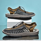 Khaki and grey cord sandals shown on white display blocks.