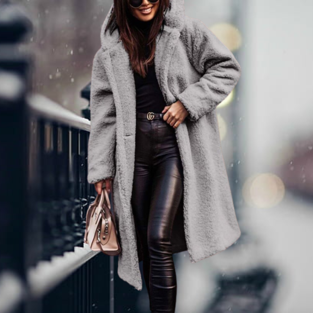 Grey long coat with a fluffy surface and hood.