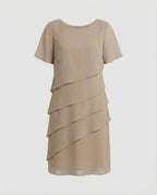Khaki short-sleeve dress with diagonal layers displayed without a model.