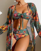 Grey floral bikini styled with an open cover-up in the same print.
