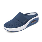 Blue mesh mule with a visible heel insert and white sole section.