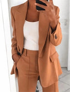 Close view of the brown jacket with flap pocket and cuff buttons.