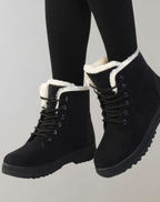 Black lace-up ankle boots with rounded toes and light-coloured lining.