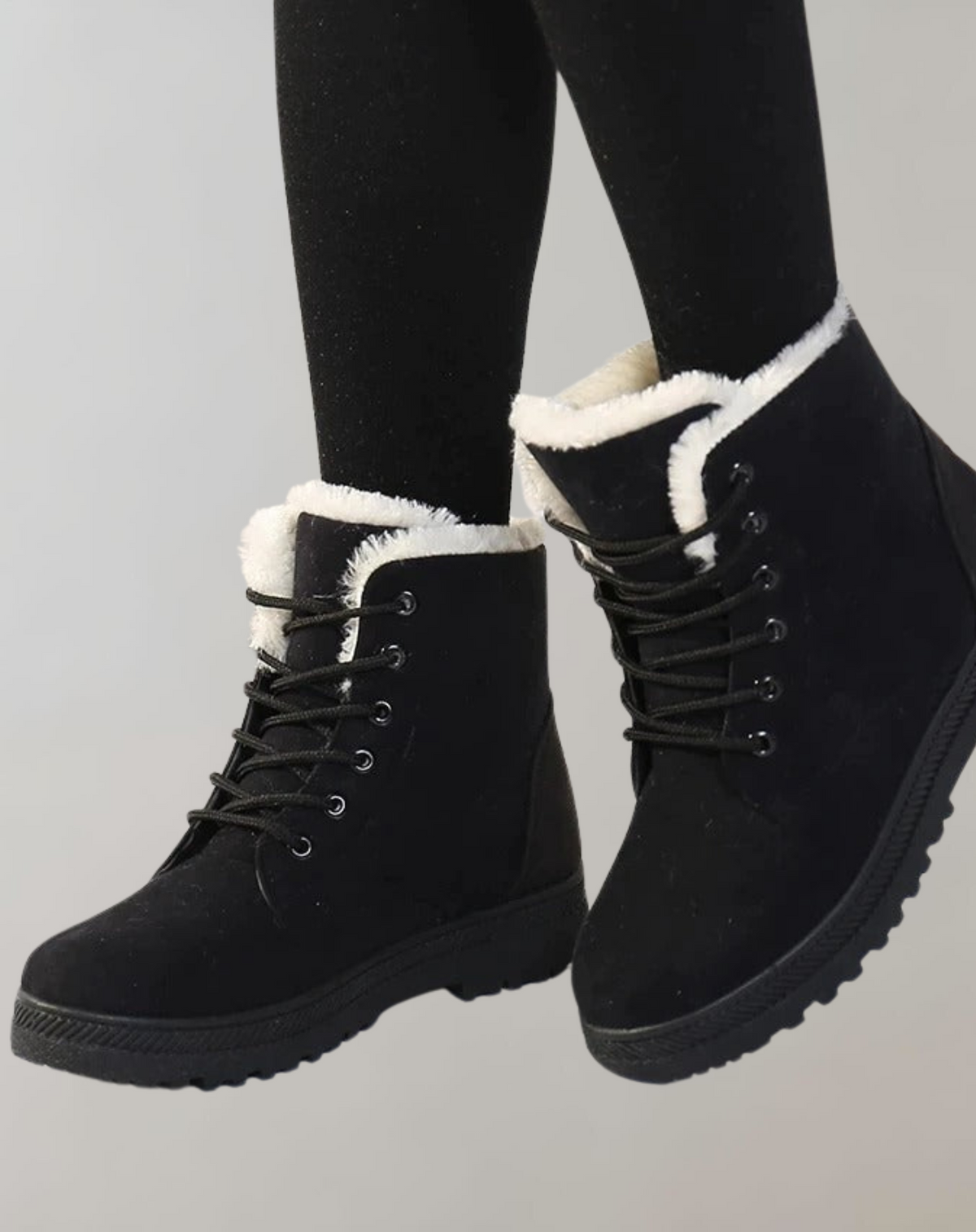 Black lace-up ankle boots with rounded toes and light-coloured lining.