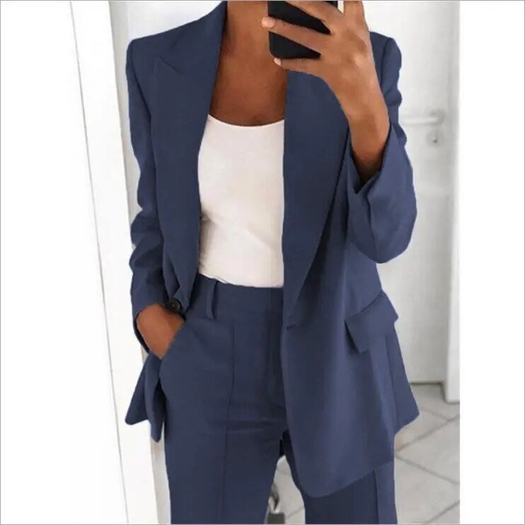 Close view of a dark blue jacket, lapels and trouser waistband.