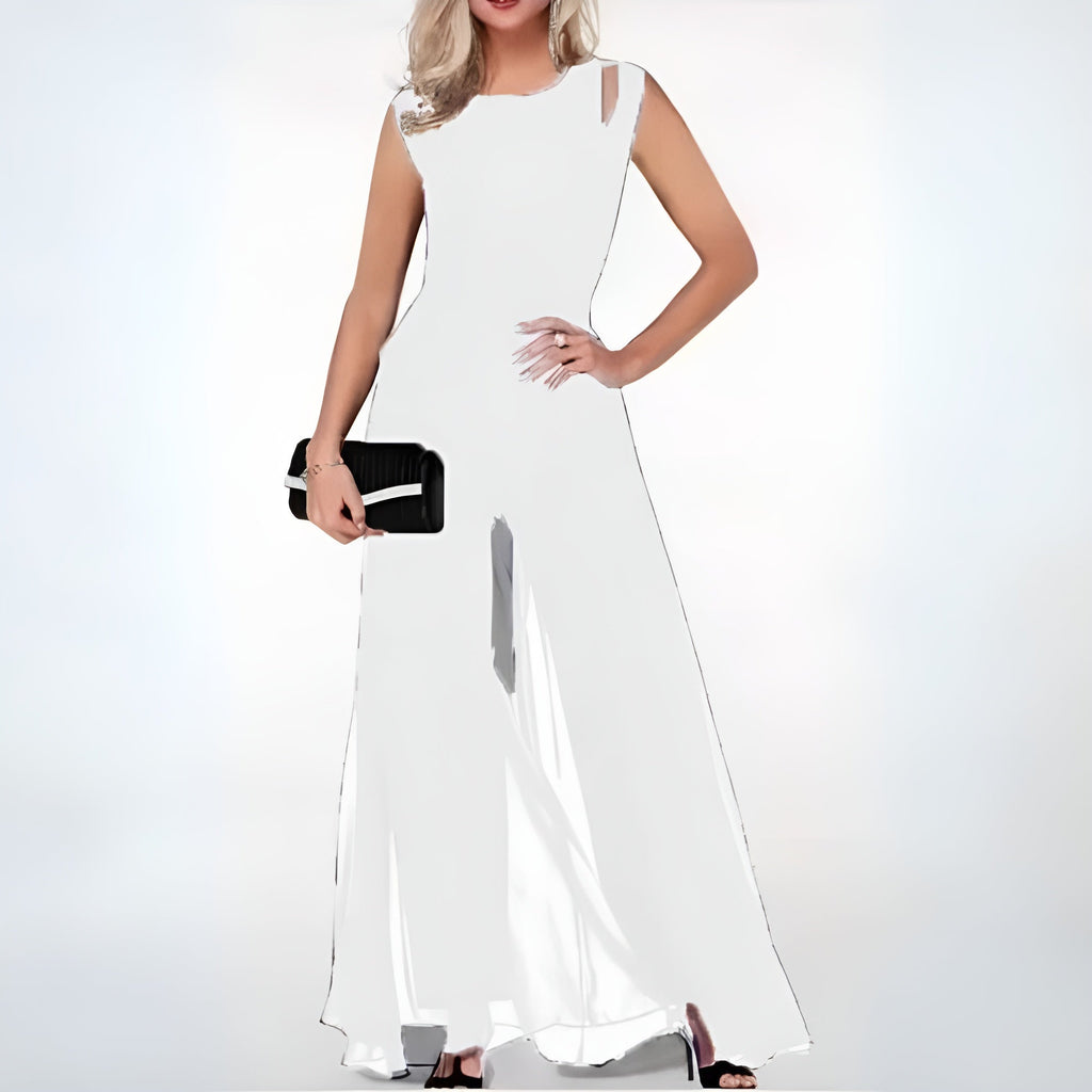 White Faelan jumpsuit with shoulder cutouts and flowing legs.