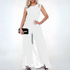 White Faelan jumpsuit with shoulder cutouts and flowing legs.