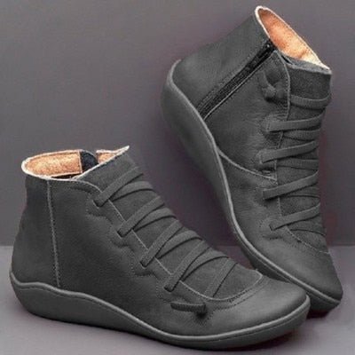 Grey ankle boots with lace-up fronts, side zips and matching soles.