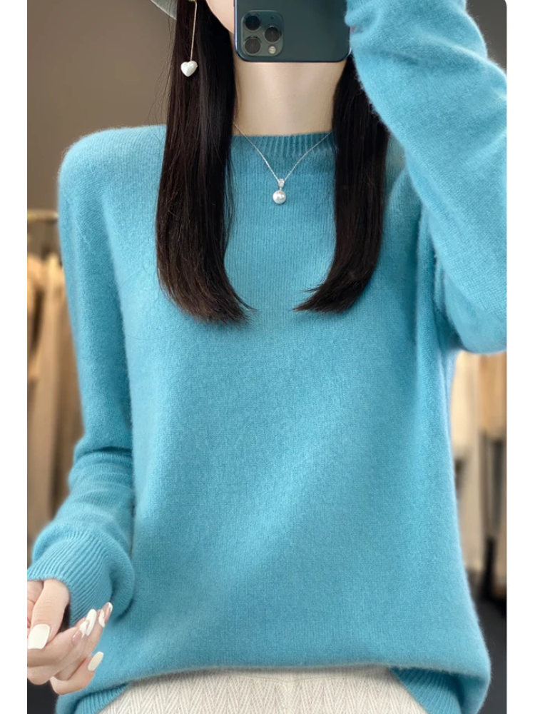 Front view of a turquoise crew-neck jumper.