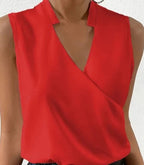 Close-up of the red top with a V-neck and short collar.