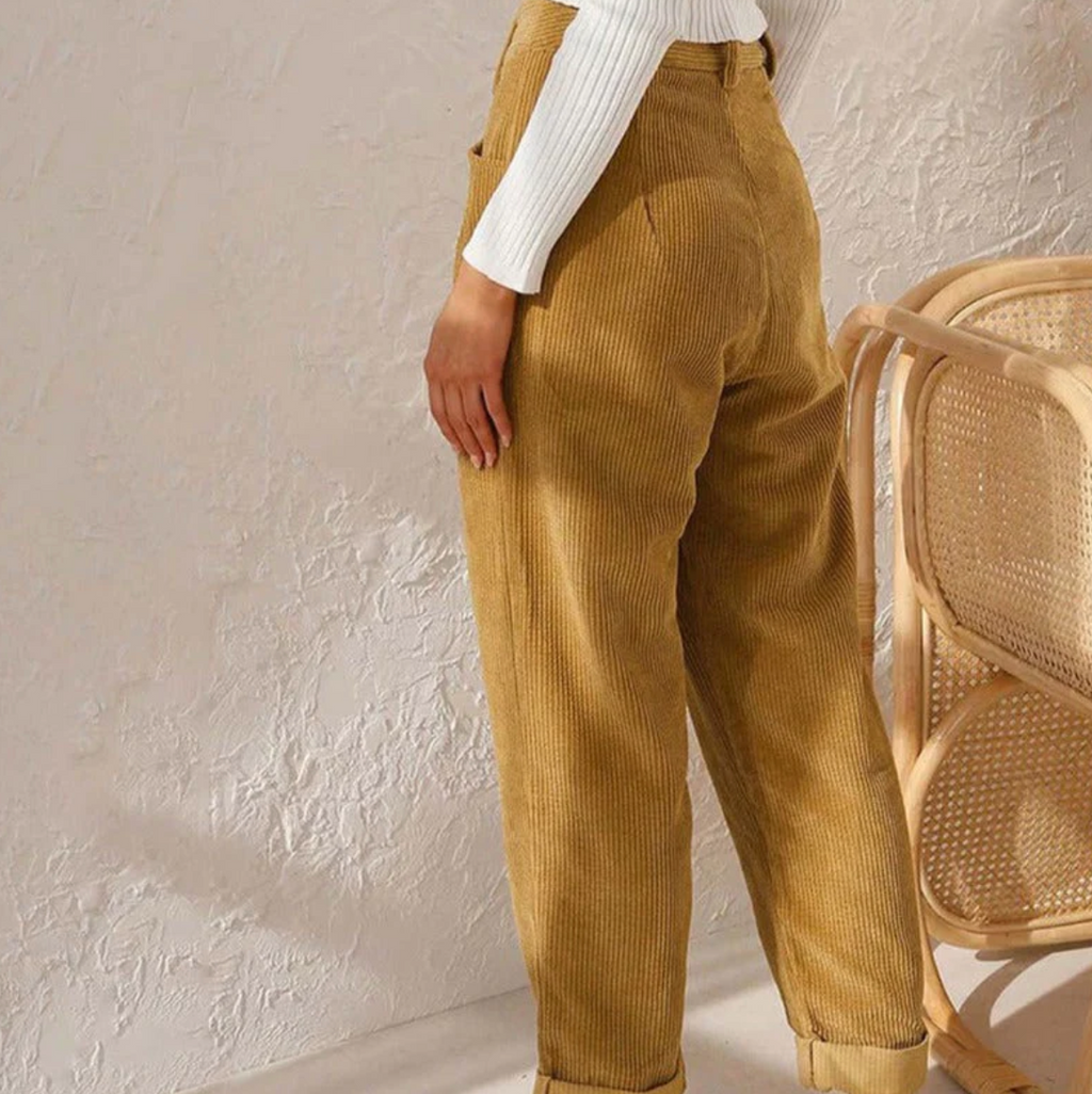 Rear view of yellow ribbed trousers.