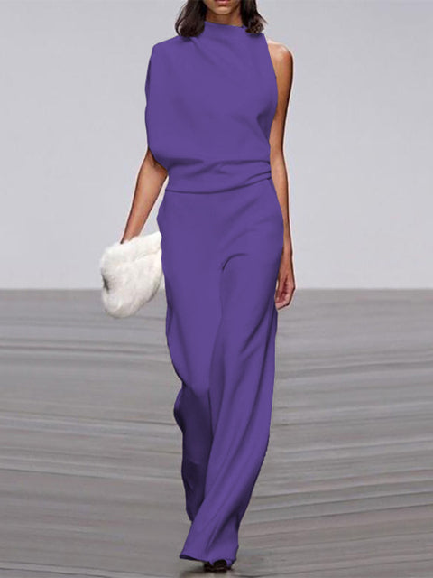Purple wide-leg jumpsuit shown from the front on a model.