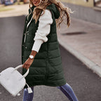Army green long quilted gilet with a hood and side pockets.