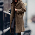 Khaki faux-fur coat worn over a dark outfit.