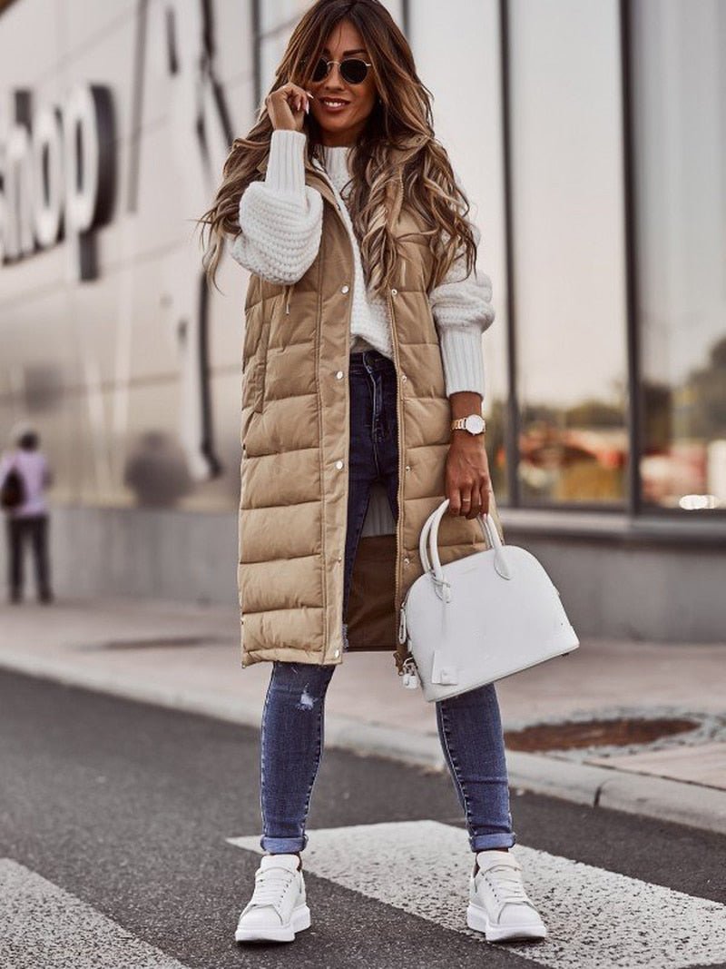 Beige Parque gilet worn open over a jumper and jeans.
