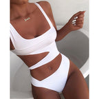 White swimsuit with a diagonal band across the waist.