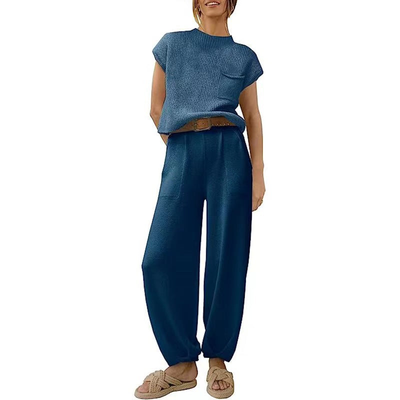 Blue two-piece outfit with a chest pocket and high trouser waist.