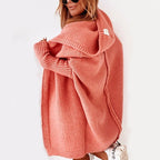 Side view of the orange cardigan with dropped shoulders.