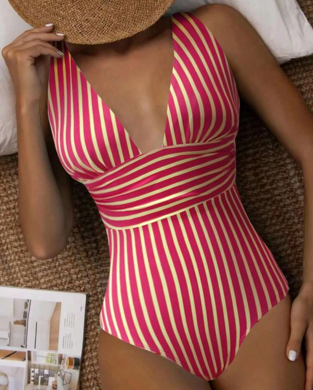 Red swimsuit with pale contrasting stripes.