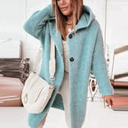 Pale blue hooded cardigan with dark front buttons and ribbed cuffs.