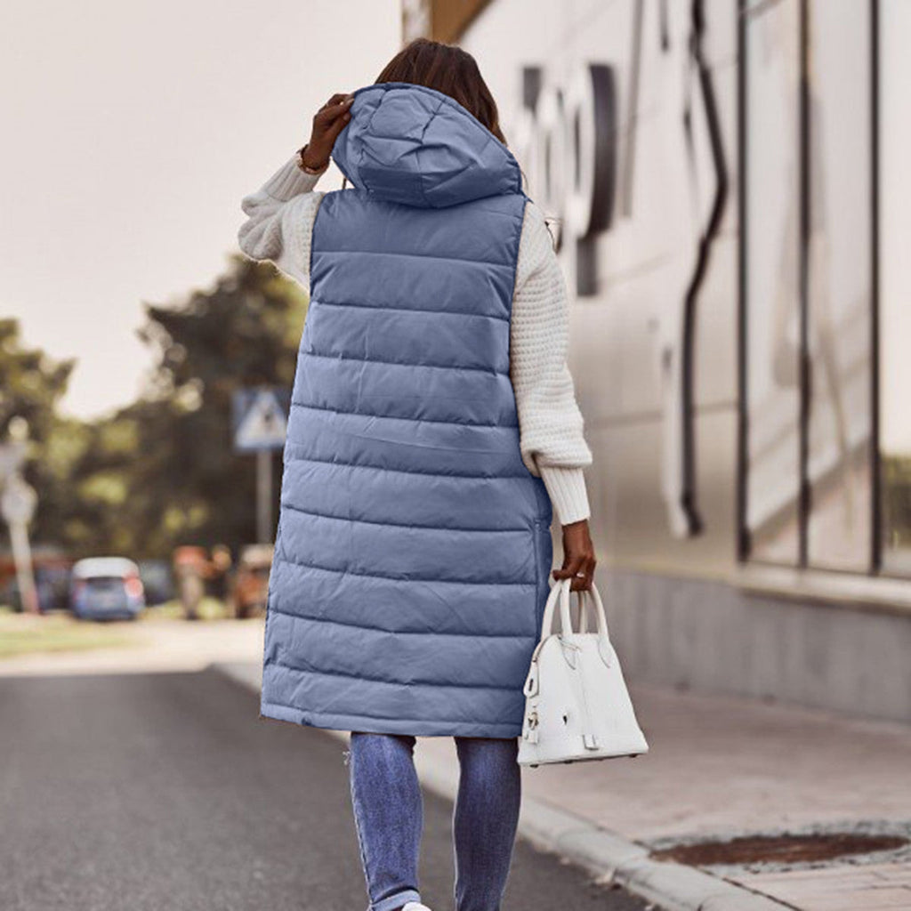 Back view of a blue long quilted gilet with a hood.