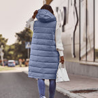 Back view of a blue long quilted gilet with a hood.