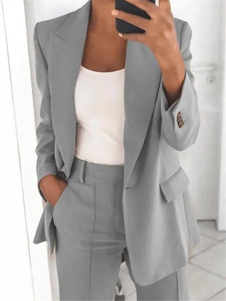 Grey jacket and trouser waistband, shown in a close view.