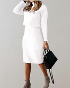 White knit jumper and slim skirt worn with ankle boots.
