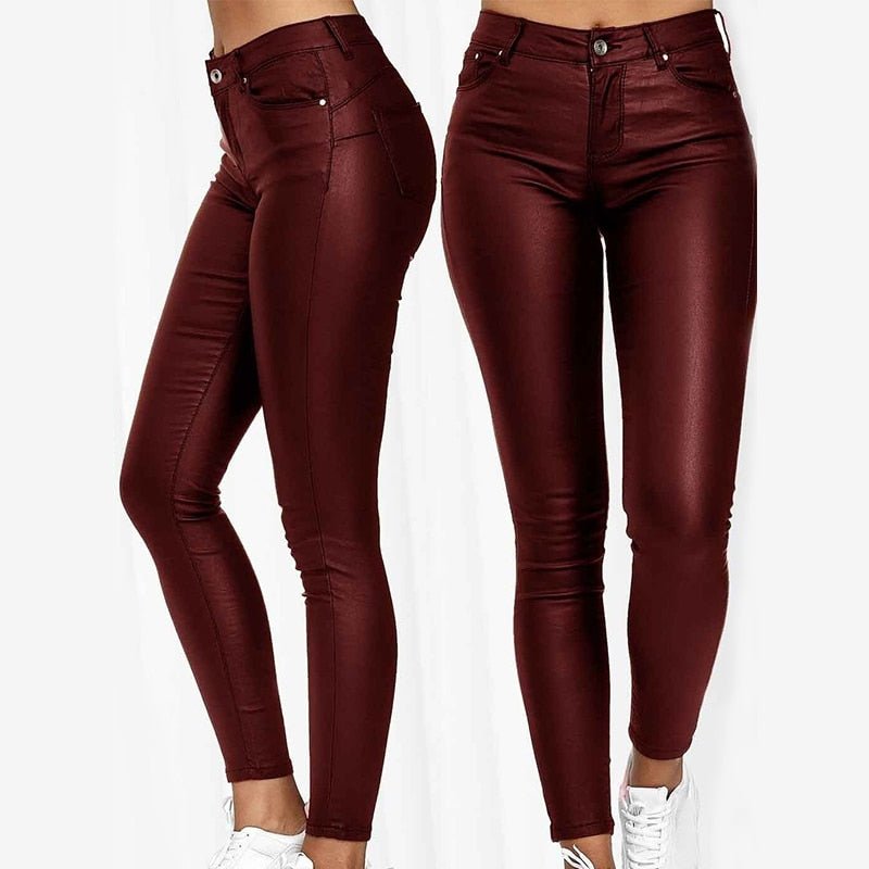 Burgundy skinny jeggings with front pockets and a button waist.