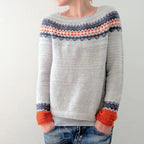 Grey knit jumper with a patterned upper band and orange cuffs.