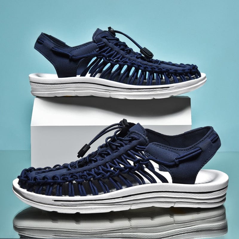 Dark blue cord sandals shown in side and three-quarter views.