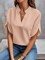 Apricot blouse with overlapping short sleeves and a V-shaped front opening.