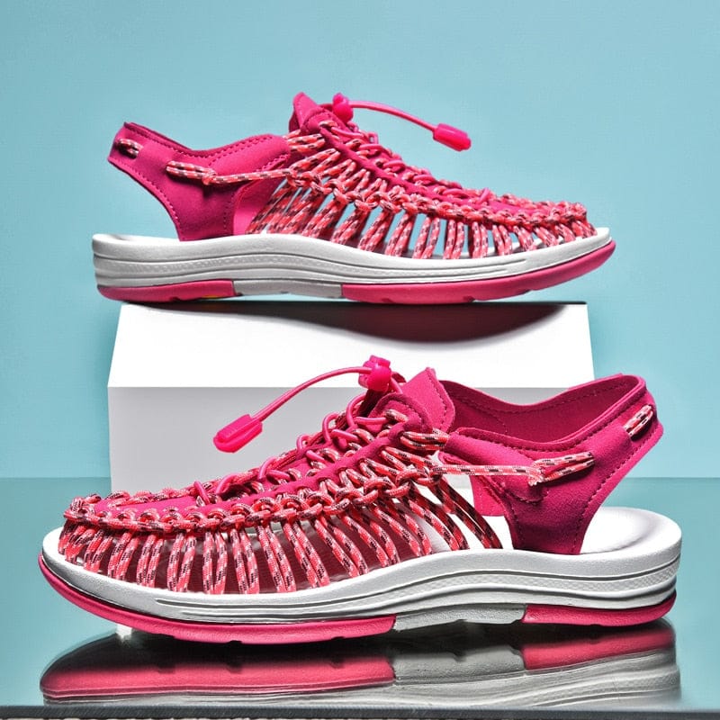 Pink cord sandals shown in side and three-quarter views.