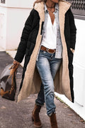 Black hooded coat with a cream textured lining.