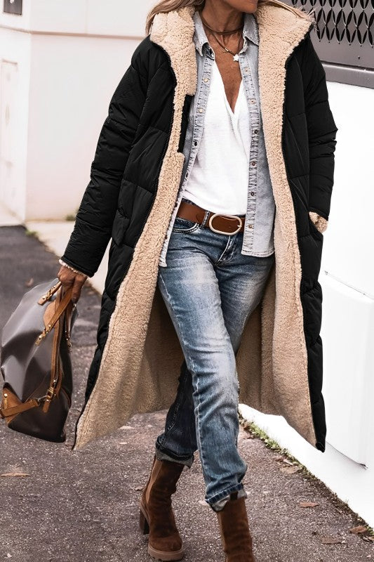 Black hooded coat with a cream textured lining.