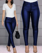 Two views of blue skinny jeggings showing their smooth finish and waistband.