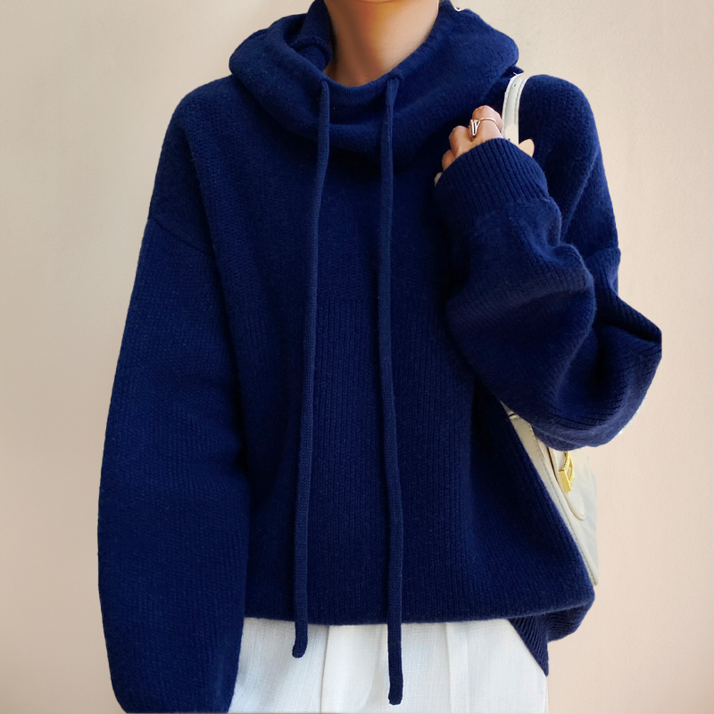 Blue jumper with a drawstring cowl neck and wide sleeves.