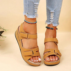 Front view of mustard-coloured open-toe sandals.