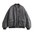 Full front view of the grey quilted bomber jacket.
