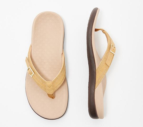 Yellow toe-post flip-flops with small buckles, shown from above and the side.