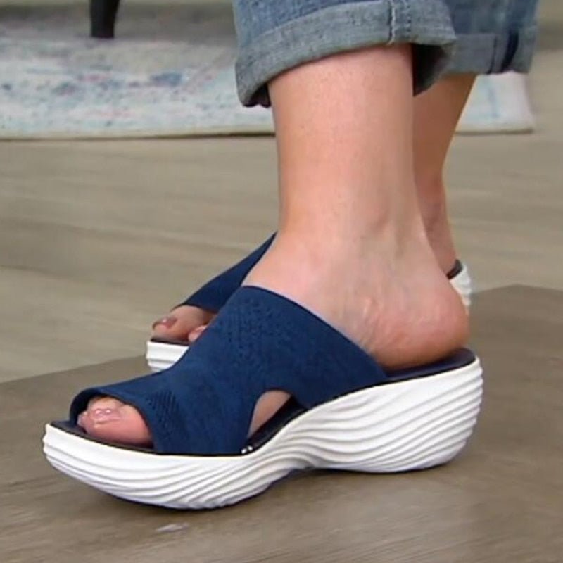 Blue Vigar sandals worn with rolled jeans.
