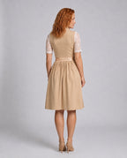 Rear view of the beige dirndl dress and white lace blouse.