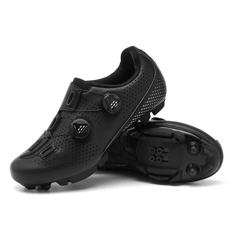Black cycling shoes with a lugged sole shown underneath.