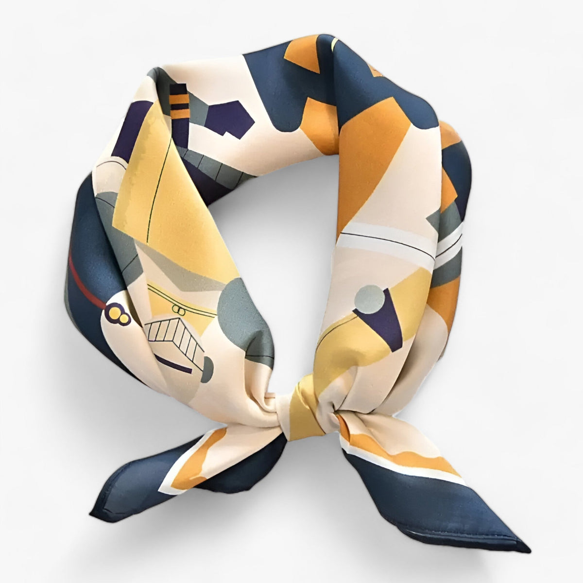Scarf with mustard, navy and cream geometric motifs tied at the front.