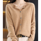Light brown cardigan with ribbed cuffs and small buttons.