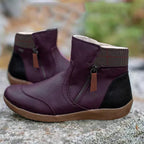 Purple ankle boots with checked collars, side zips and contrasting tan soles.
