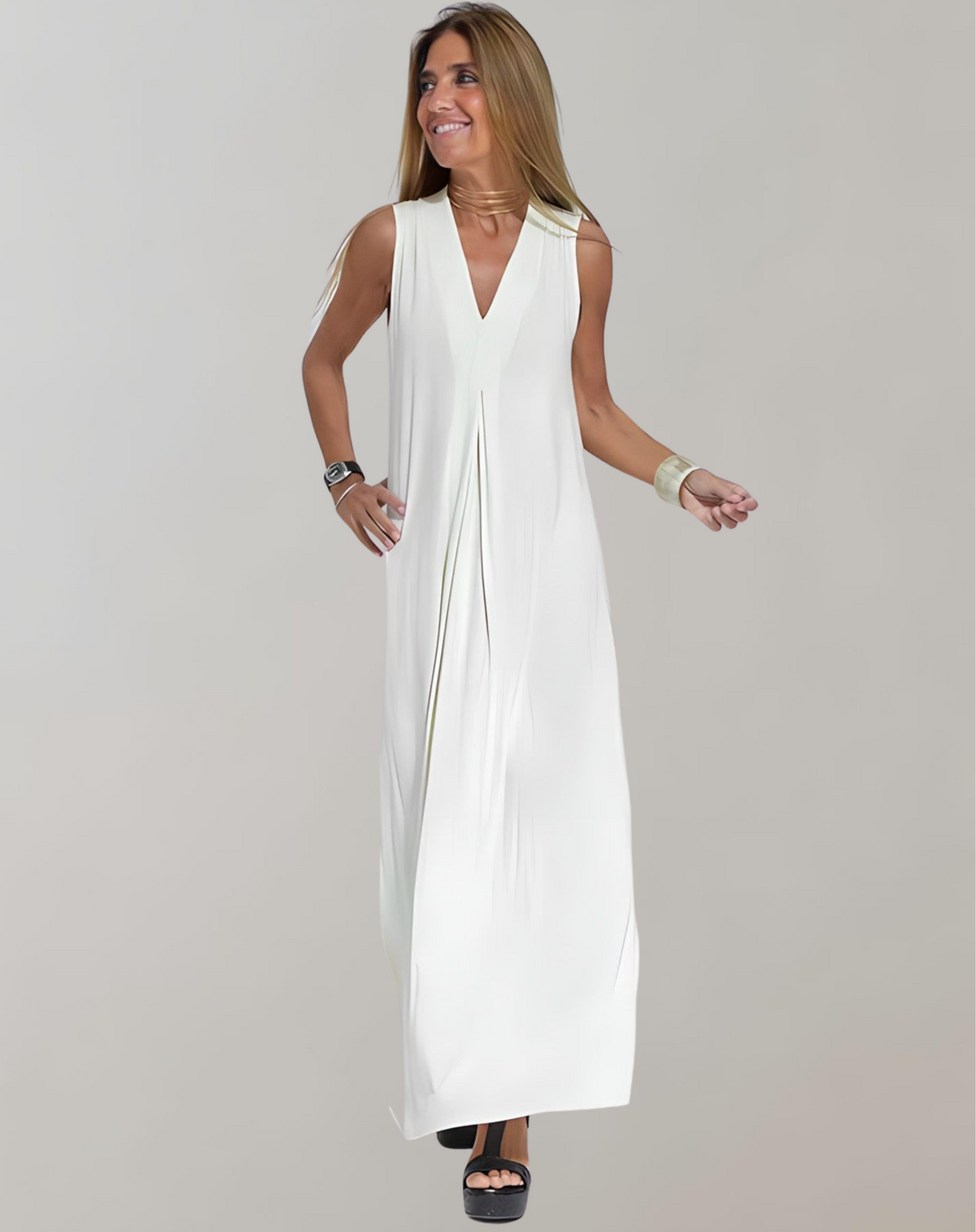White sleeveless V-neck maxi dress with a loose shape and front pleat.